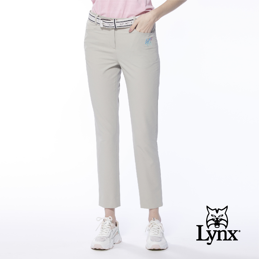 【Lynx Golf】女款吸濕排汗彈性布料後片透氣織帶設計窄管九分褲(二色)