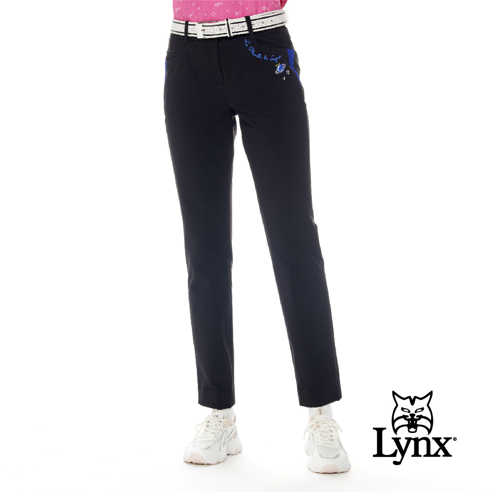 【Lynx Golf】女款日本進口布料彈性舒適LOGO鬆緊帶設計口袋配布剪接造型窄管長褲-黑色